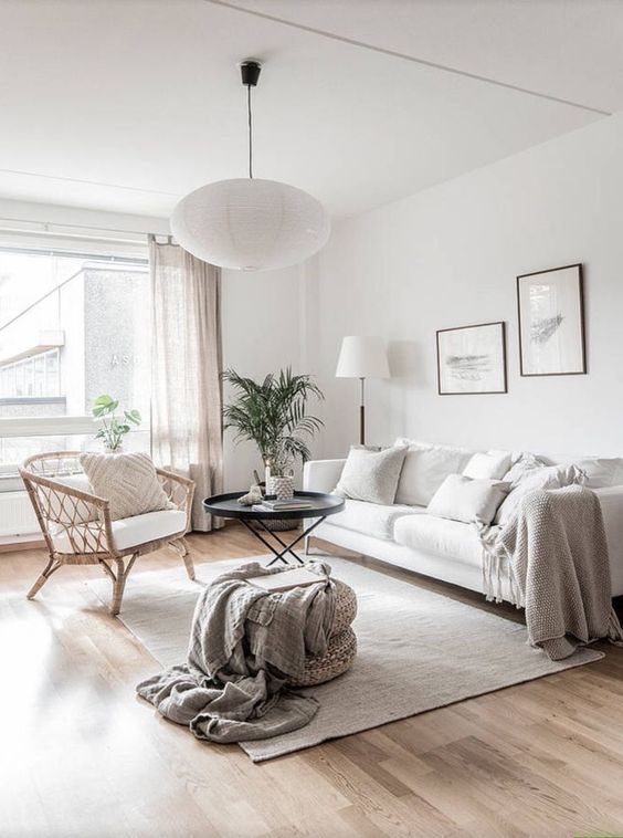 a woven chair placed in front of the window doesn't prevent light from coming inside and doesn't prevent the owners from enjoying the views