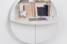 16 a sleek minimalist storage unit on the wall can be transformed into a comfortable yet small desk