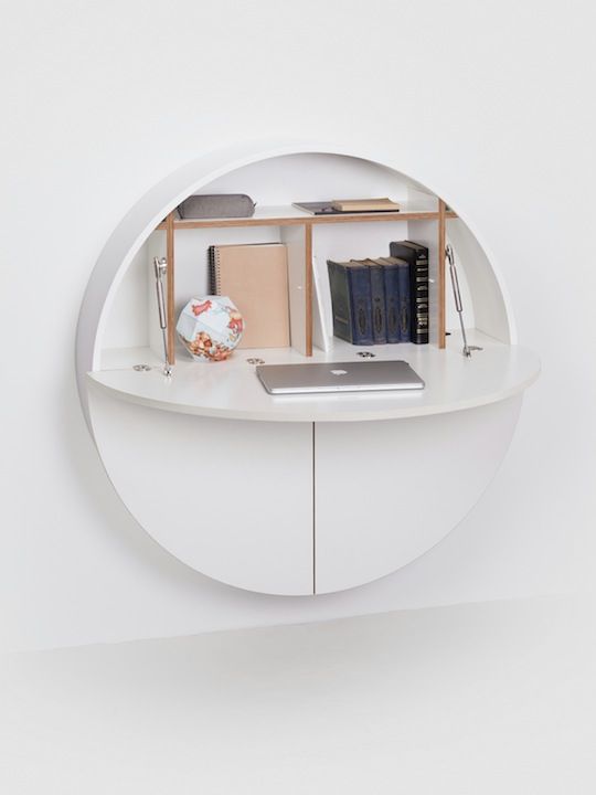 a sleek minimalist storage unit on the wall can be transformed into a comfortable yet small desk