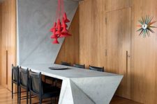 16 a uniue sculptural concrete kitchen island that climbs up the wall, and the floor that completes the look