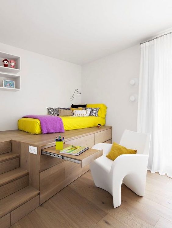 a genius idea for a small kids' bedroom - built-in storage units and even a desk to hide when not in need