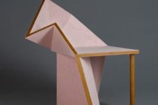 23 a unique pink geometric chair with a single leg and a solid base, which is shaped sculpturally