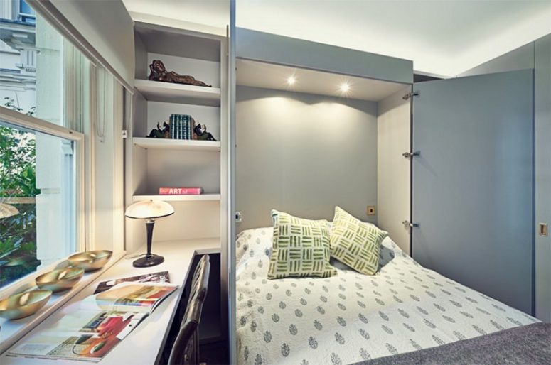 a home office with a hidden Murphy bed behind the doors lets the space double as a bedroom and home office