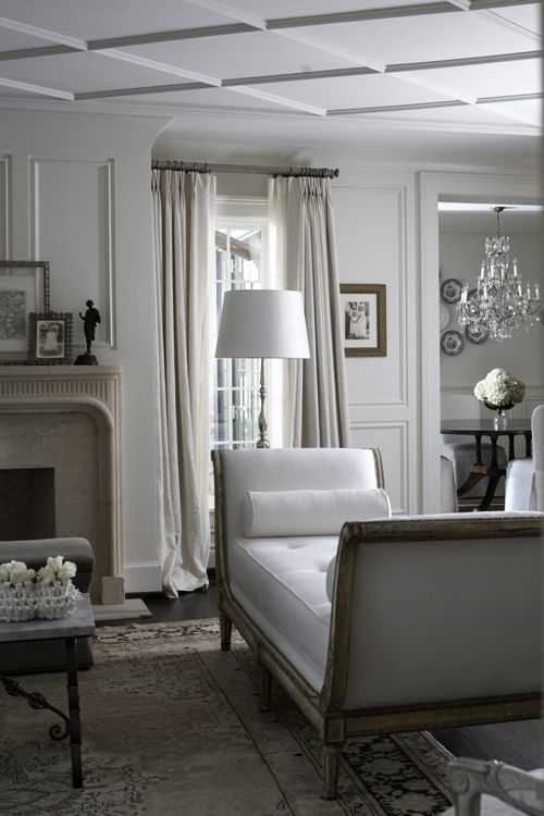 a backless sofa with high armrests adds style to the space and makes it more refined