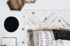 25 hexagon-shaped wooden shelves attached over the bed perfectly finish off the boho bedroom decor