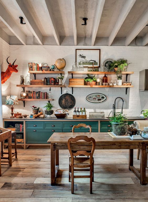 a-bright-eclectic-kitchen-pairign-teal-cabinets-rustic-wooden-furniture-potted-plants-and-a-faux-animal-head.jpg