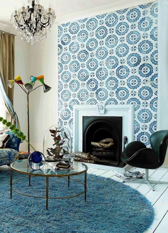a built-in vintage fireplace clad with blue and white patterned tiles that stand out and make the space more refined