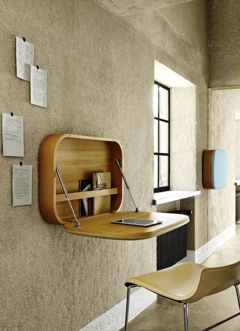 a chic wooden Murphy desk with curved angles and some storage for notebooks inside is a stylish option