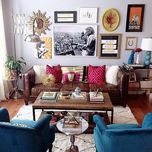 a-colorful-eclectic-living-area-with-a-crazy-gallery-wall-velvet-and-leather-furniture-an-industrial-coffee-table.jpg