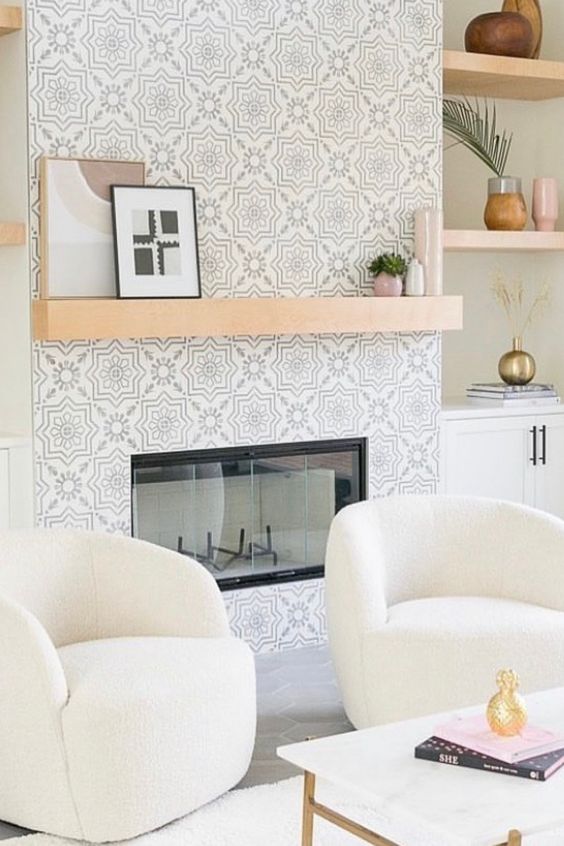 a fireplace clad with neutral printed tiles is a perfect fit for a living room, it looks very cohesive here
