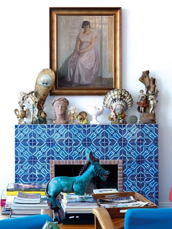 a fireplace with such a bold blue printed tile surround can easily become a focal point in any space