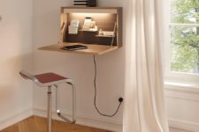 a small and sleek Murphy desk with a desktop, some shelves inside and additional light, which is great for a corner