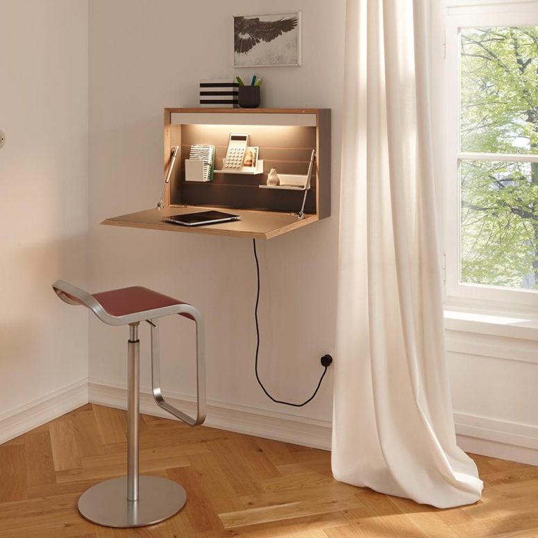 a small and sleek Murphy desk with a desktop, some shelves inside and additional light, which is great for a corner