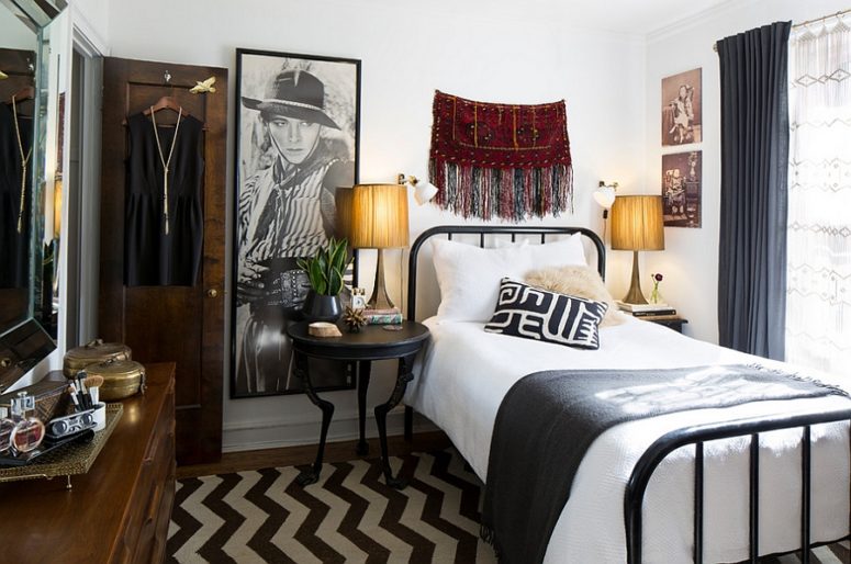 a small eclectic bedroom mixing up boho and mid-century modern decor and with an elegant mix of black and white