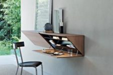 a unique Murphy desk integrated into a gorgeous geometric storage unit with additional lights inside is a very creative solution