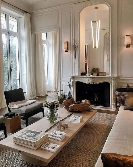 a Parisian living room done in neutrals - off-white, ocher, light greys and jsut some touches of dark shades