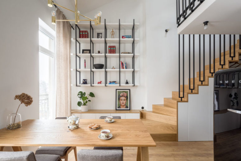 an interior with a cool credenza There's a large suspended shelving unit and a floating credenza that provide storage space yet don't look bulky