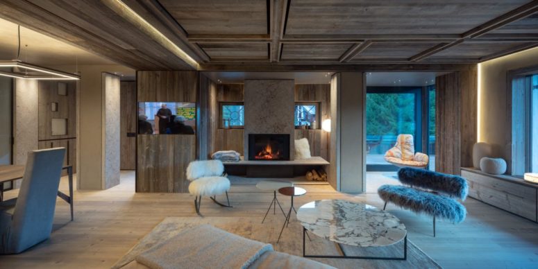 Both zones benefit from a built in fireplace, and there's a glazed space with a chair to read books or enjoy views Both zones benefit from a built-in fireplace, and there's a glazed space with a chair to read books or enjoy views