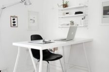 05 a stylish Nordic home office in white, with a sleek desk, some shelves and negative space