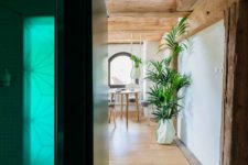 06 The bathroom is done in neutrals but the green lights all over make the space brighter and whimsier