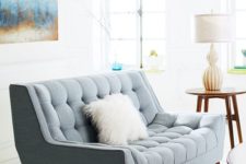 07 a lovely powder blue loveseat with a fluffy pillow will easily match a mid-century modern interior