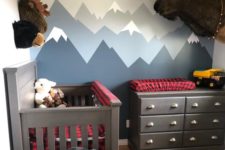 07 a woodland inspired nursery with red and navy plaid textiles that add print and color to the space
