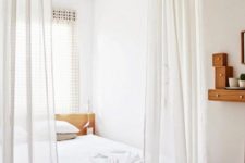 08 a sheer white curtain is a perfect option to separate a sleeping space from the rest of your apartment