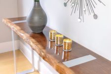 12 a sleek entryway console with a live edge and contrasting metal legs for a chic and one-of-a-kind look