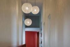 13 contemporary woven pendant lamps finish off the space and bring enough light to the hallway