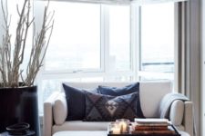 an ottoman and a loveseat are an ultimate combo for a tiny room