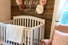 20 name letters and fabric flowers on the wall will accent a girl’s nursery and make it cuter and more delicate