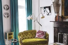 21 an eclectic living room with colorful touches and a pistachio green loveseat with tufted upholstery that adds chic