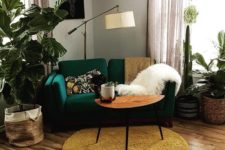 22 an emerald loveseat and a mustard rug create a chic mid-century modern nook in bright tones