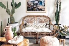 23 a boho desert living room finished off with a rattan loveseat with soft fur and a tassel pillow
