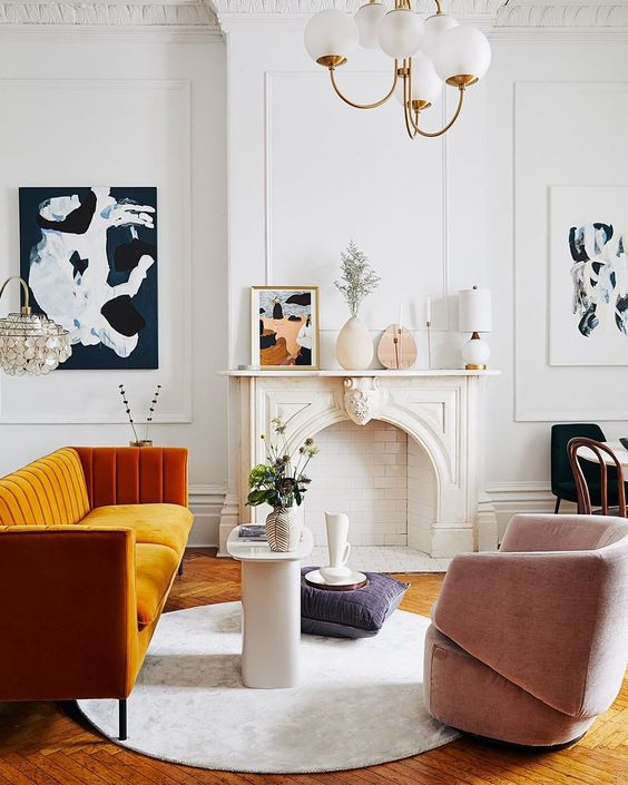 a more contemporary version of a fireplace matches the mid-century modern Parisian living room