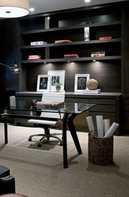 a black home office refreshed with a light colored floor and built in lights plus a white chair