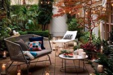 25 a mid-century modern chic rattan loveseat with grey upholstery is an idela solution for this backyard