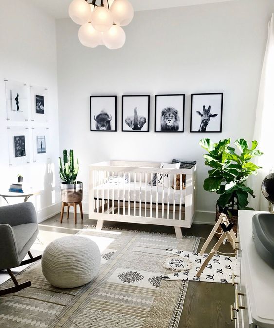 a stylish black and white gallery wall with animals is a super stylish idea that fits a gender neutral space