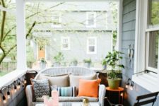 26 a white wicker loveseat can be easily squeezed into a small porch like this one to create a sitting space here