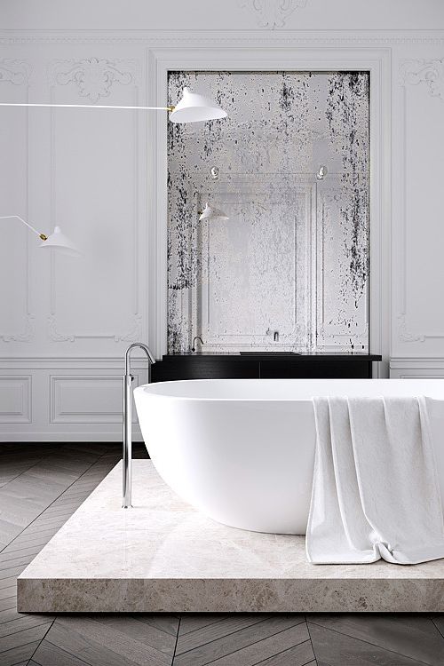 a minimalist Parisian bathroom with a tub on a stone platform, a vintage mirror, stucco walls and catchy minimal lamps a minimalist Parisian bathroom with a tub on a stone platform, a vintage mirror, stucco walls and catchy minimal lamps