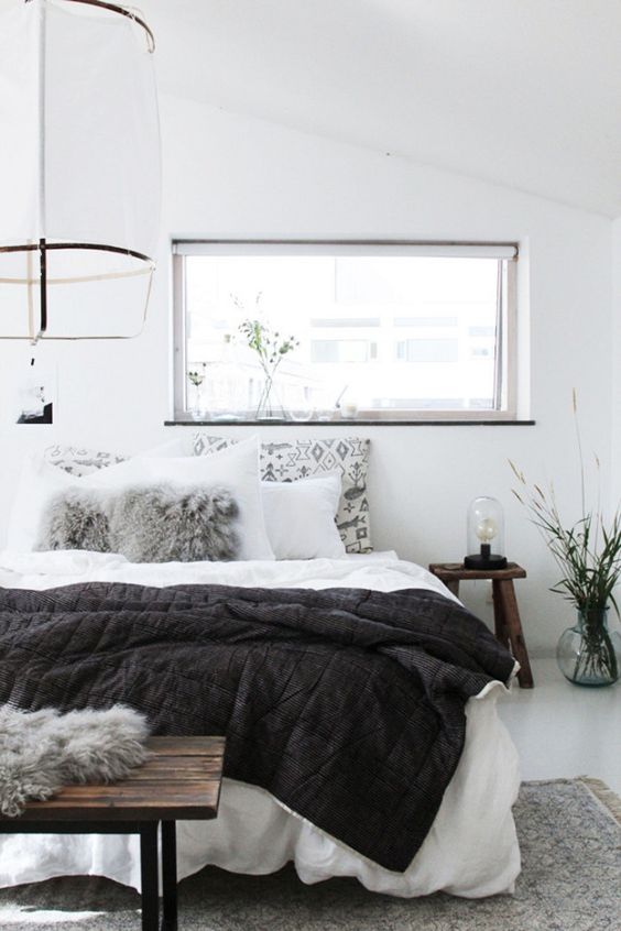 an airy bedroom done in white and accented with light greys can be spruce dup with black touches anytime   just add a black blanket or bedding
