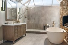 wood imitating tiles, faux stone, a vintagw wooden vanity with a stone countertop and a contemporary bathtub for a gorgeous transitional space