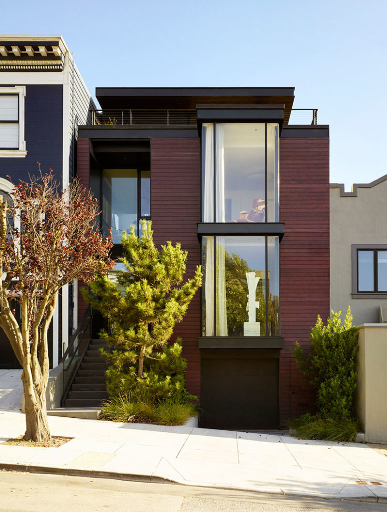This contemporary home is done with a burgundy facade and features cool contemproary interiors with a character This contemporary home is done with a burgundy facade and features cool contemproary interiors with a character