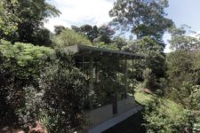 02 The house is built into a slope and looks totally harmonious there, glass walls allow enjoying the views