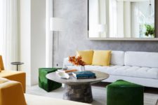 02 The living room is done with yellow and green touches and geometric shapes plus a statement mirror