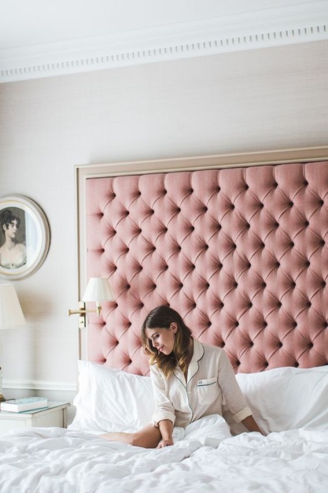 an oversized pink tufted headboard in a frame is a veyr girlish, cute and elegant idea to try