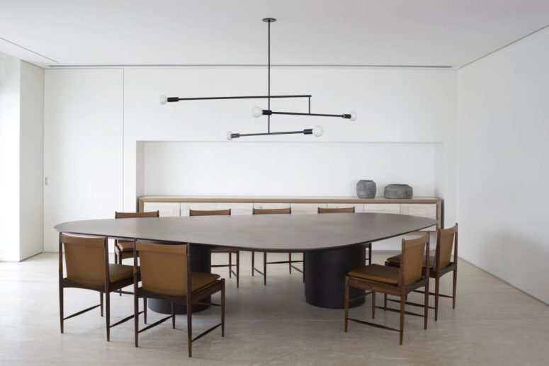 The dining table is very large and surrounded by eight elegant and comfortable chairs as the owners often have guests The dining table is very large and surrounded by eight elegant and comfortable chairs as the owners often have guests