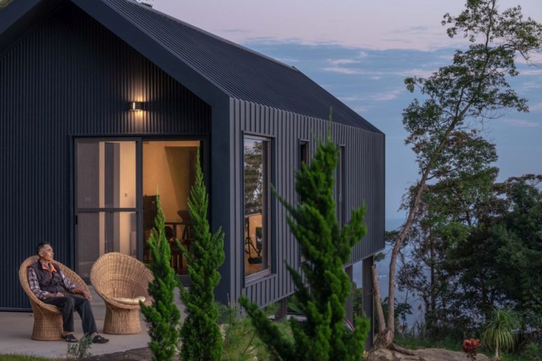 a cool terrace design for a mountain home The facades and roof of the house are covered in metal sheets, giving the structure an industrial flair, there are several terraces