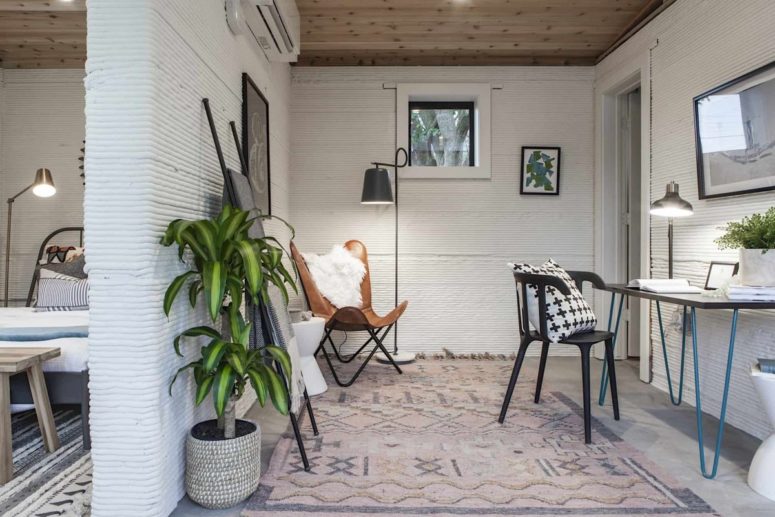 The home office is done in neutrals plus black touches and a bright desk with hairpin legs to bring mid century modern aesthetics in The home office is done in neutrals plus black touches and a bright desk with hairpin legs to bring mid-century modern aesthetics in