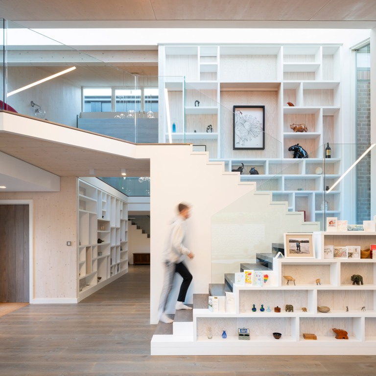 house with lots of cool storage solutions The inside of the house is pretty contemporary, there are large open spaces, functional storage solutions and built-in furniture